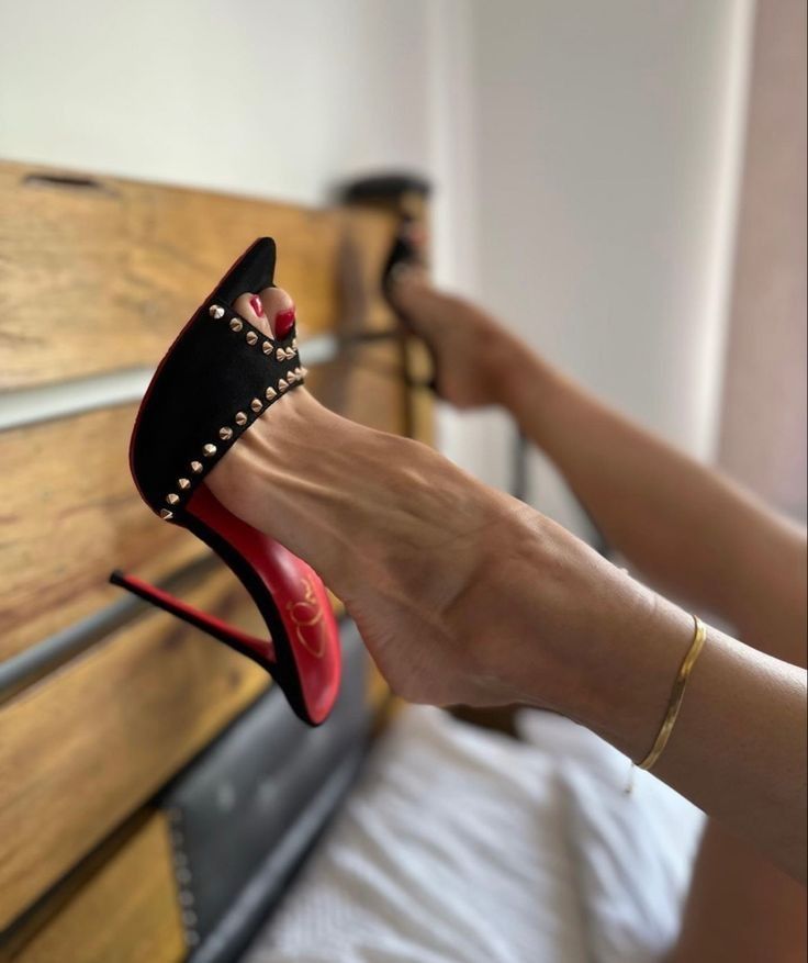 a person's feet in high heels